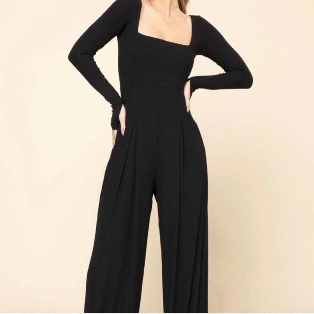 Popflex long sleeve jumpsuit with flared legs.